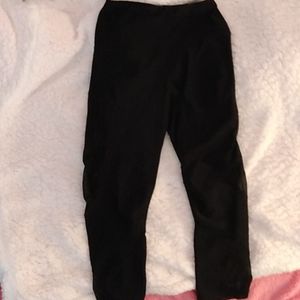 Adult extra small black leggings with a little mesh see-through on the legs